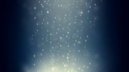 An glowing antique book against a blue background